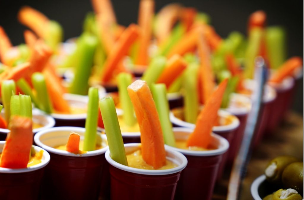 Catering Hummus with celery sticks and carrots